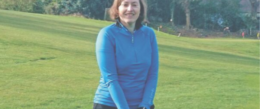 Carol with golf club