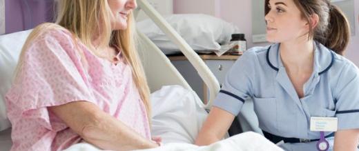 Nurse with a patient in Ellis ward