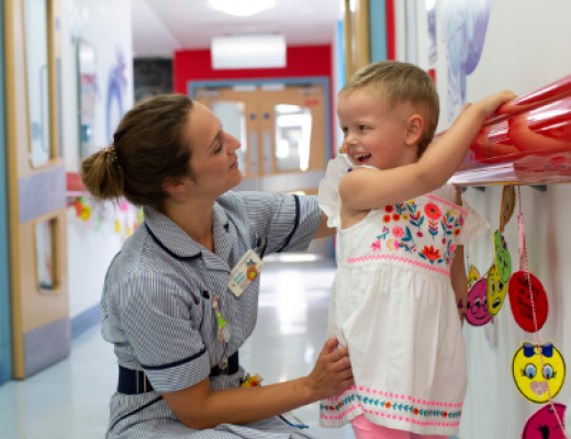 Nurse in hall with a child patient