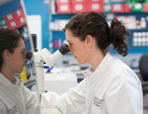 scientist with microscope
