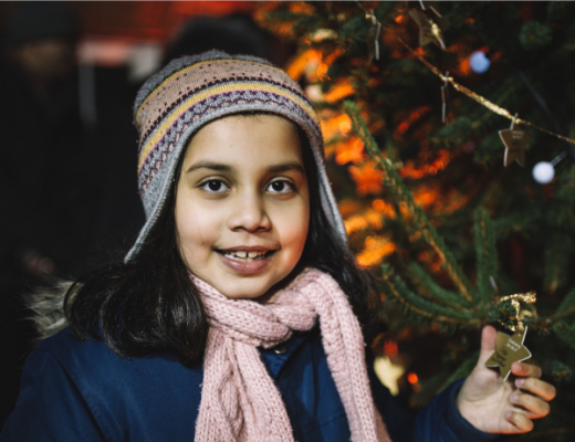 Image of a young girl holding a star