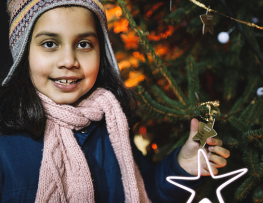 Image of young girl holding her Celebrate a Life star