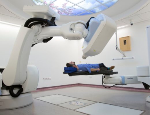 man on cyberknife machiene
