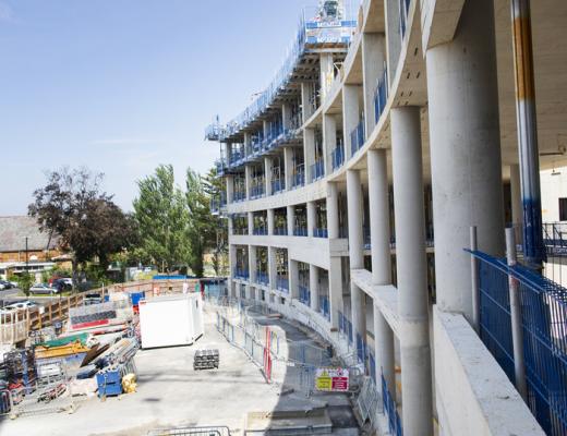 Large building under construction with scaffolding