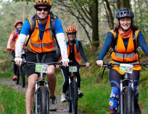 Cyclists taking on the lake district triple challenge 