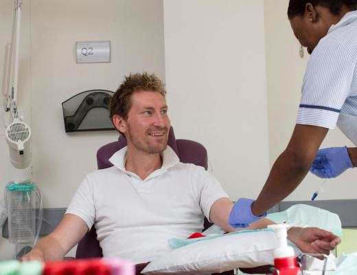 Mark receives immunotherapy treatment from a nurse at The Royal Marsden