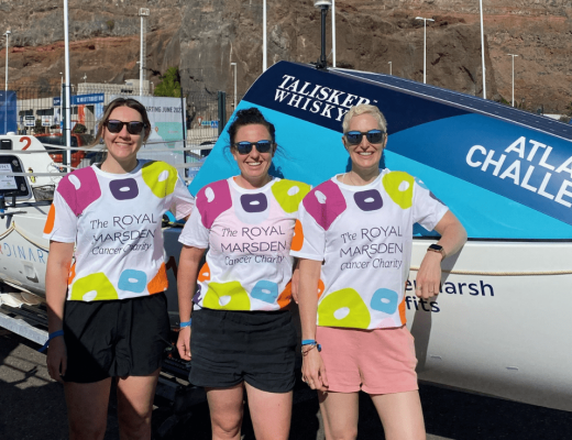 Team ExtraOARdinary with their boat, wearing The Royal Marsden Cancer Charity shirts