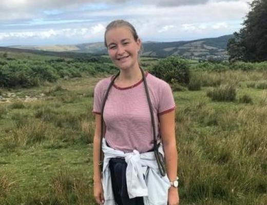 Banham employee, Laura stands in a field smiling for the camera