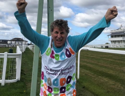 Royal Marsden patient and supporter Bob Pain wearing a Charity vest and cheering