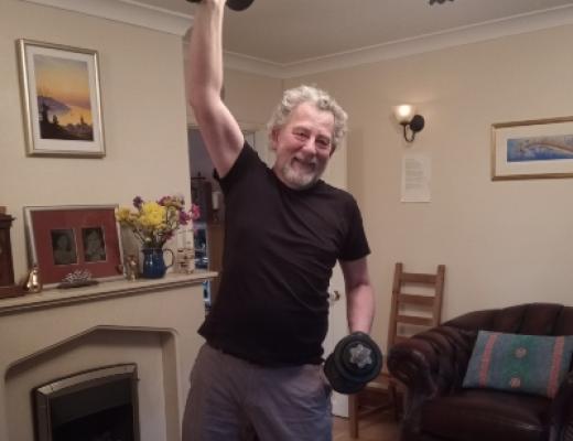 Patient David exercising in his house