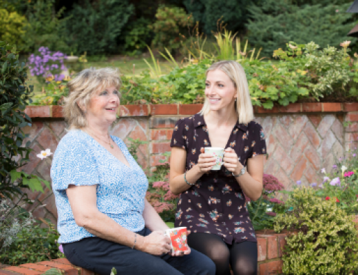Photo of Christine and Stephanie chatting in the garden