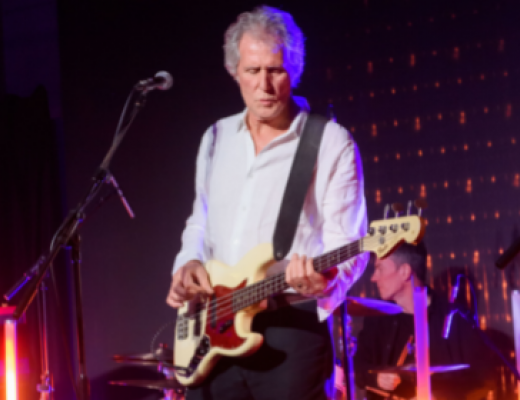 John Illsley of the band Dire Straits playing guitar