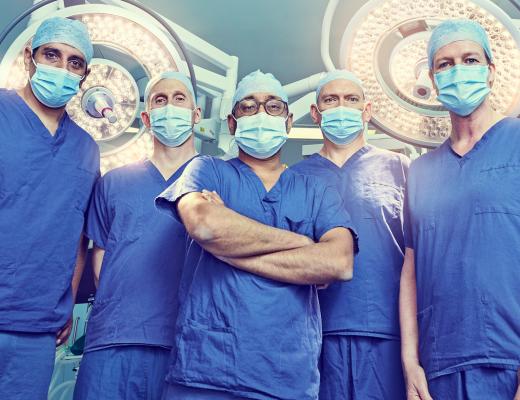 Super Surgeons in theatre wearing their scrubs and masks at The Royal Marsden