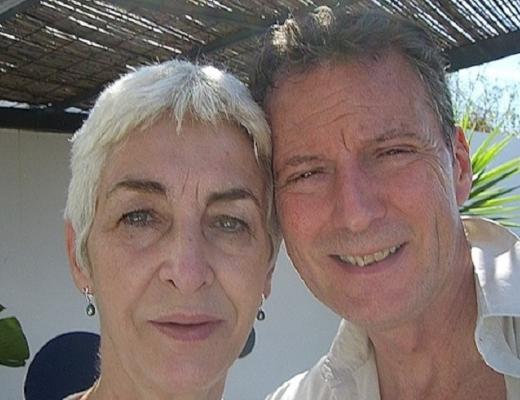 Michael and Pip in a sunny setting under a canope 