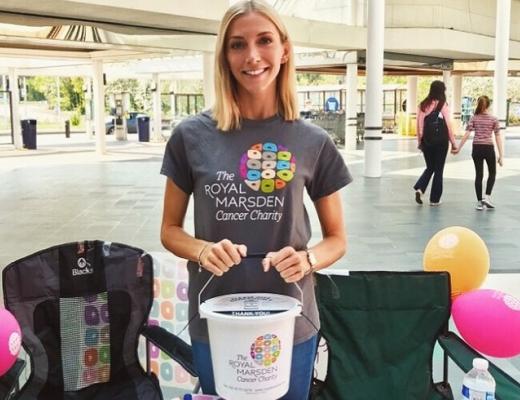 Image of a woman with a money collection bucket raising funds for the charity