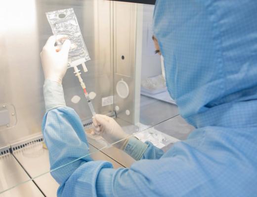 Nurse working in a sterile cellular therapy lab at The Royal Marsden in Sutton