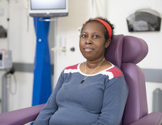 Miranda in hospital sitting down looking at the camera